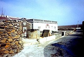 stone walls such as this one constructed of blocks quarried from the coral reefs
			have been protecting these island communities for thousands of years